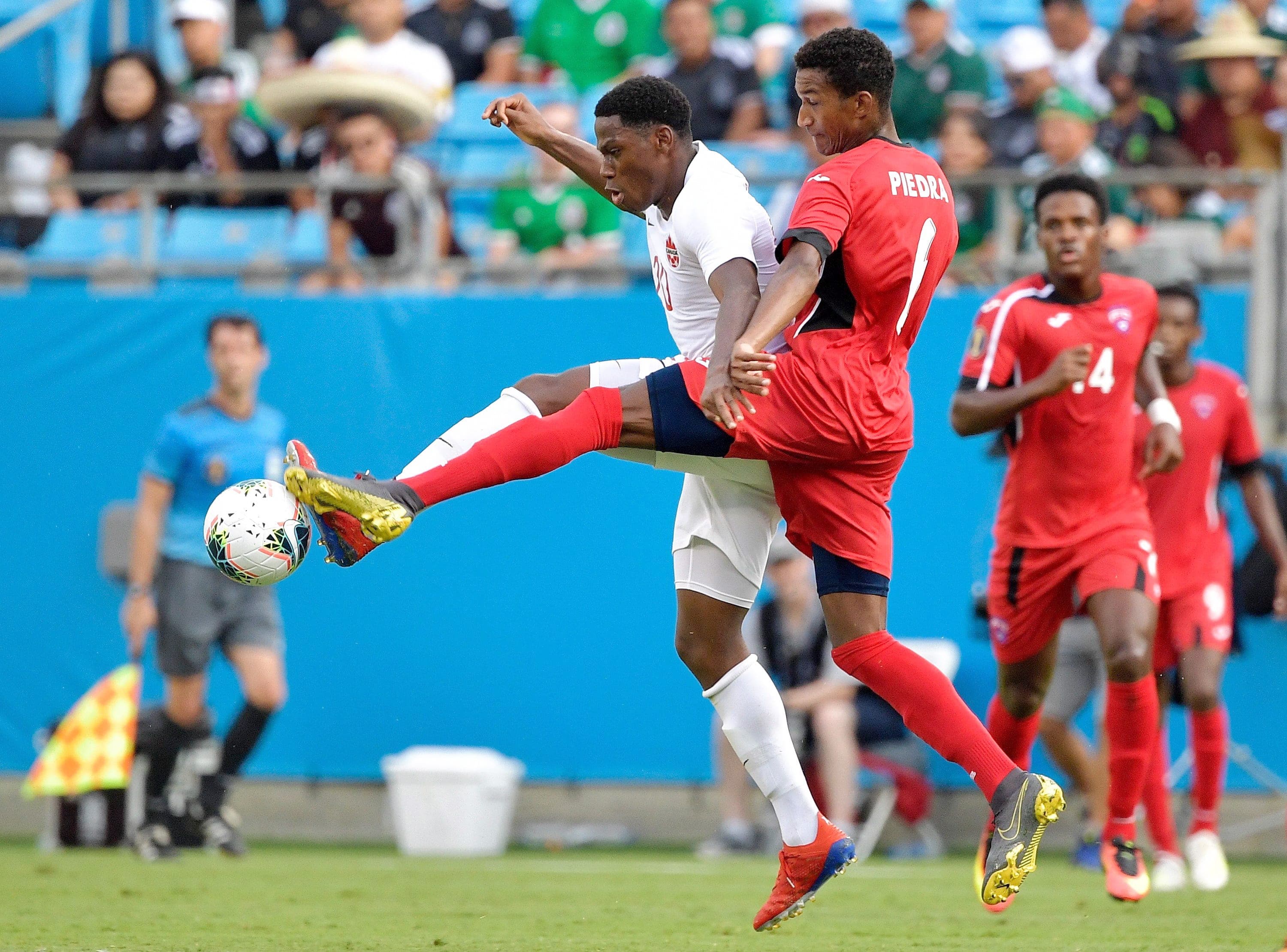 Jonathan David (uniforme blanc) que l’on voit en action dans un match contre Cuba en 2019, a procuré la victoire au Canada hier.